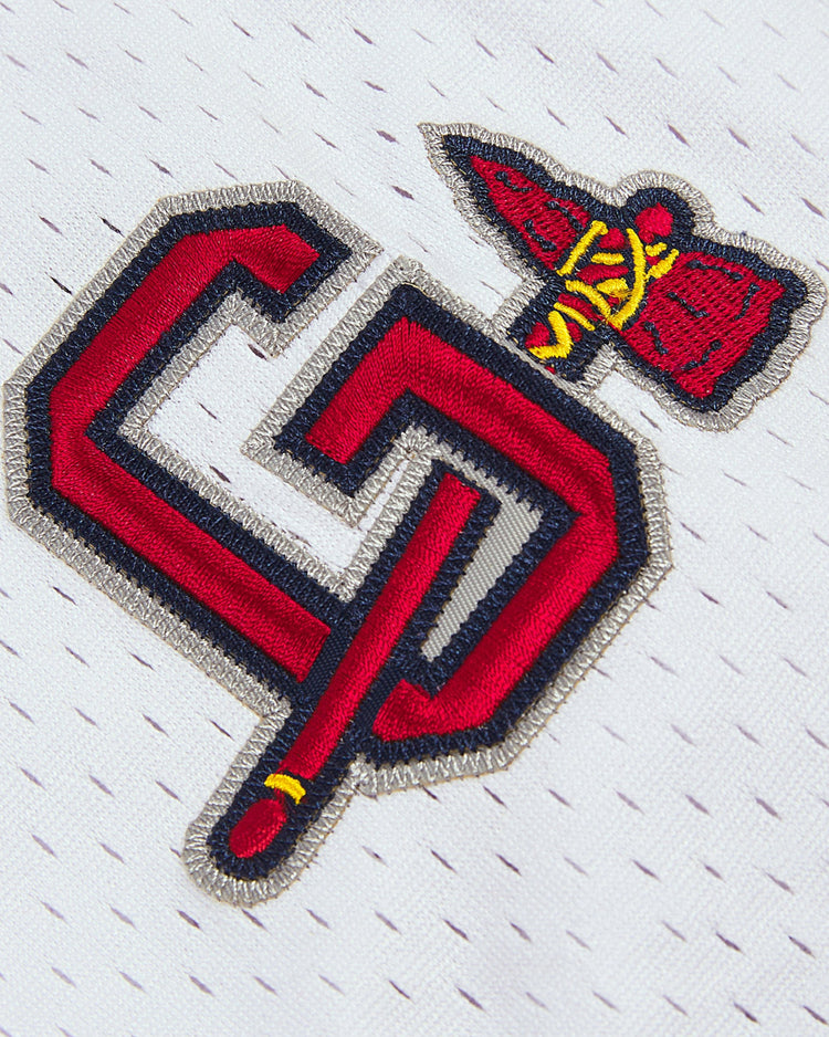 Close-up of the Ebbets Field Ronald Acuña Jr. Gwinnett Braves Mesh Button-Up Jersey, featuring a white vintage design with a red and black interlocking A and C logo and a tomahawk, inspired by the classic Gwinnett Braves style.