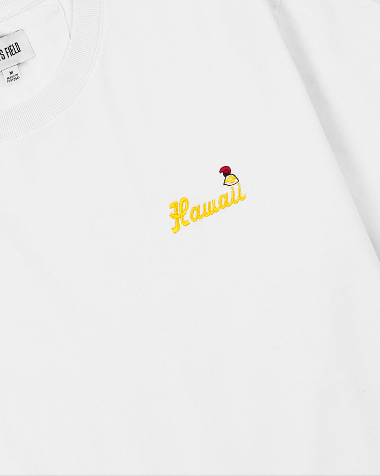 The Ebbets Field Hawaii Islanders (PCL) Embroidered Hawaii Short Sleeve Tee is a white 200gsm cotton shirt, featuring Hawaii in yellow script with a red and yellow mushroom on the chest, capturing classic PCL legacy style.