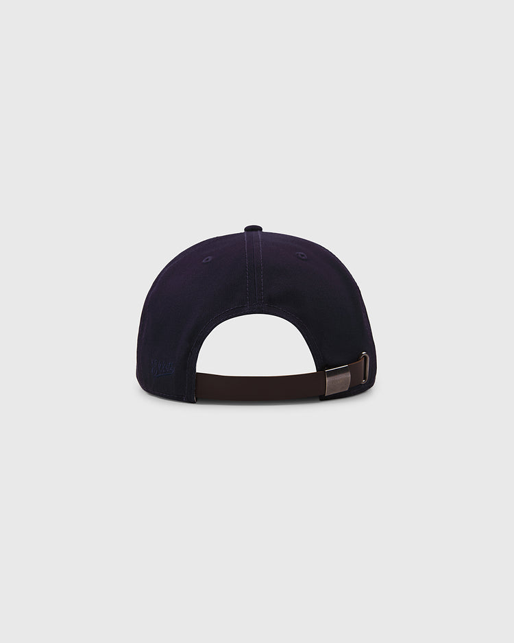 The Ebbets Field Brooklyn Eagles Cotton Twill Ballcap in navy is shown from the back, featuring a brown adjustable strap with a metal buckle, set against a plain light gray background.