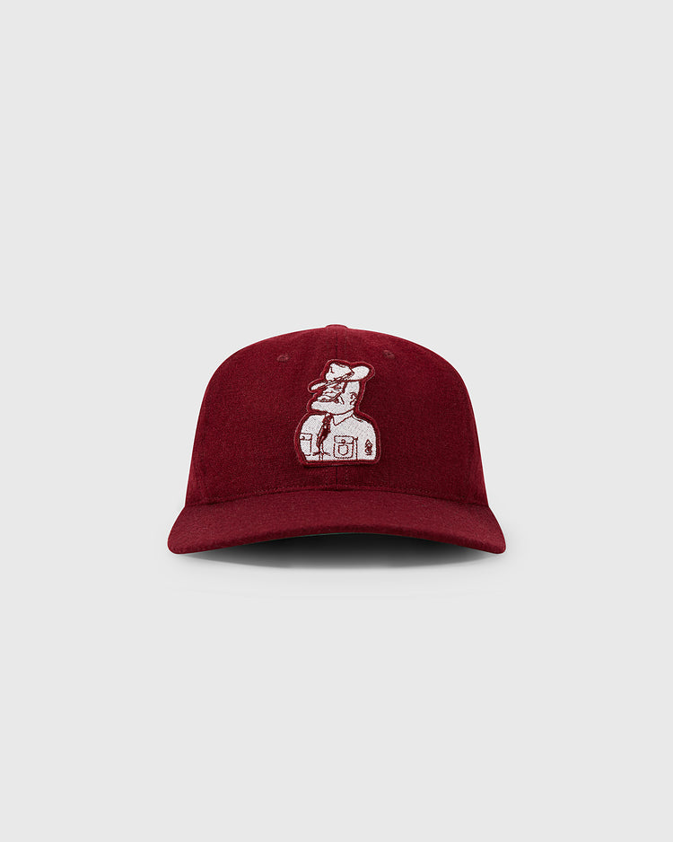 The EFF Texas A&M Aggies Mascot Collegiate Wool Ballcap in burgundy has a vintage look with an embroidered bear standing on a washing machine, shown against a plain light gray background.
