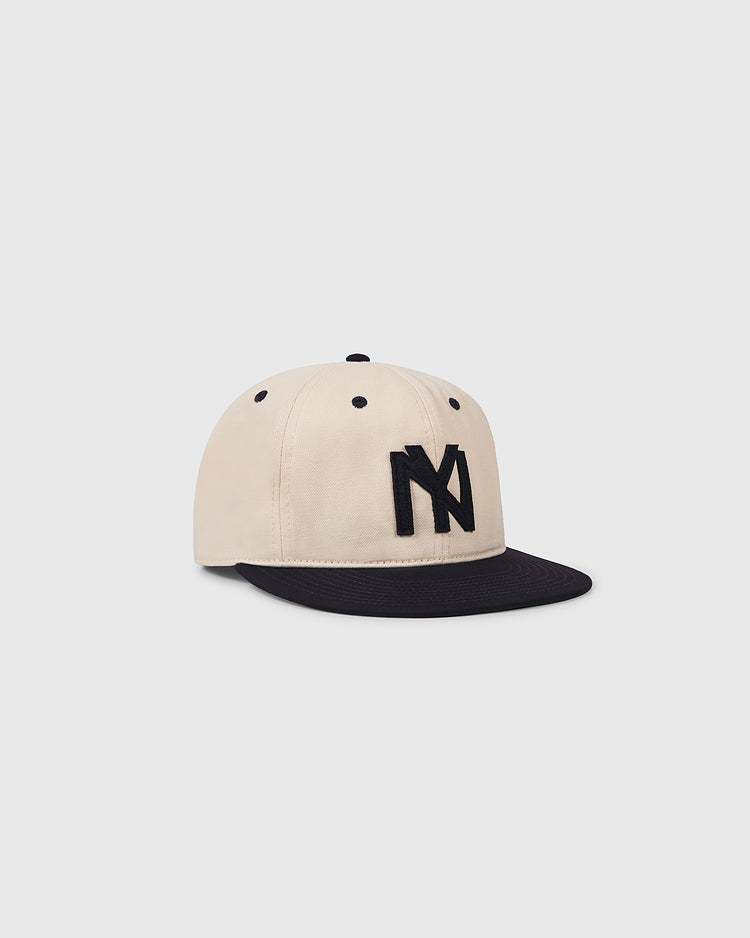 The Brooklyn Eagles 1935 Cotton Twill Ballcap by Ebbets Field features a beige crown, black brim, and bold black NY logo, shown here against a plain white background.