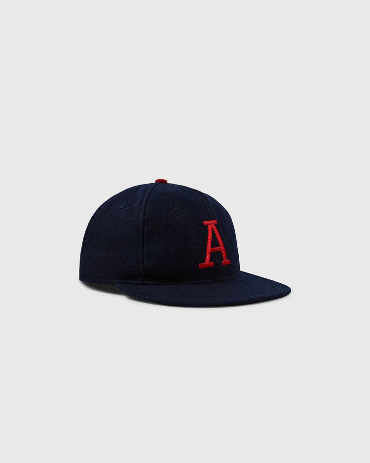 The EFF University of Arizona 1963 Vintage Ballcap is a dark blue wool cap with a flat brim and bold red A embroidery on the front, shown on a light gray background—ideal for any Arizona Wildcats collector.