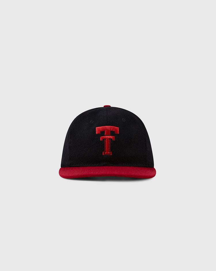 The Texas Tech University 1956 Vintage Ballcap by Ebbets Field Flannels is a black cap with a red brim and bold red T embroidery, shown on a plain light gray background.