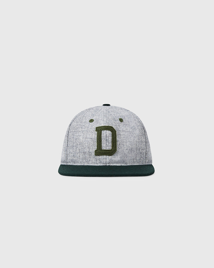 The EFF Dartmouth College 1942 Vintage Ballcap features gray wool, a dark green brim, and a large embroidered green D, authentically reproducing the classic style of the original, displayed on a plain light background.