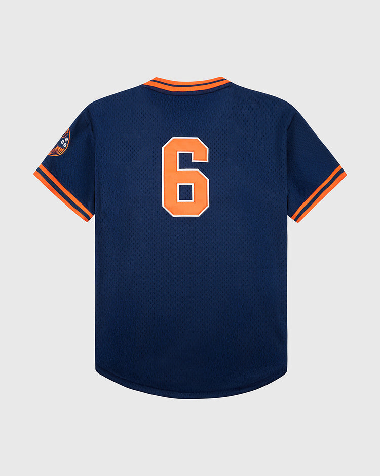 The Hiroshima Carp Mesh V-Neck Jersey by Ebbets Field features navy blue mesh, orange and white sleeve and collar trim, a bold orange and white number 6 on the back, a left sleeve patch, and design inspired by vintage team logos.