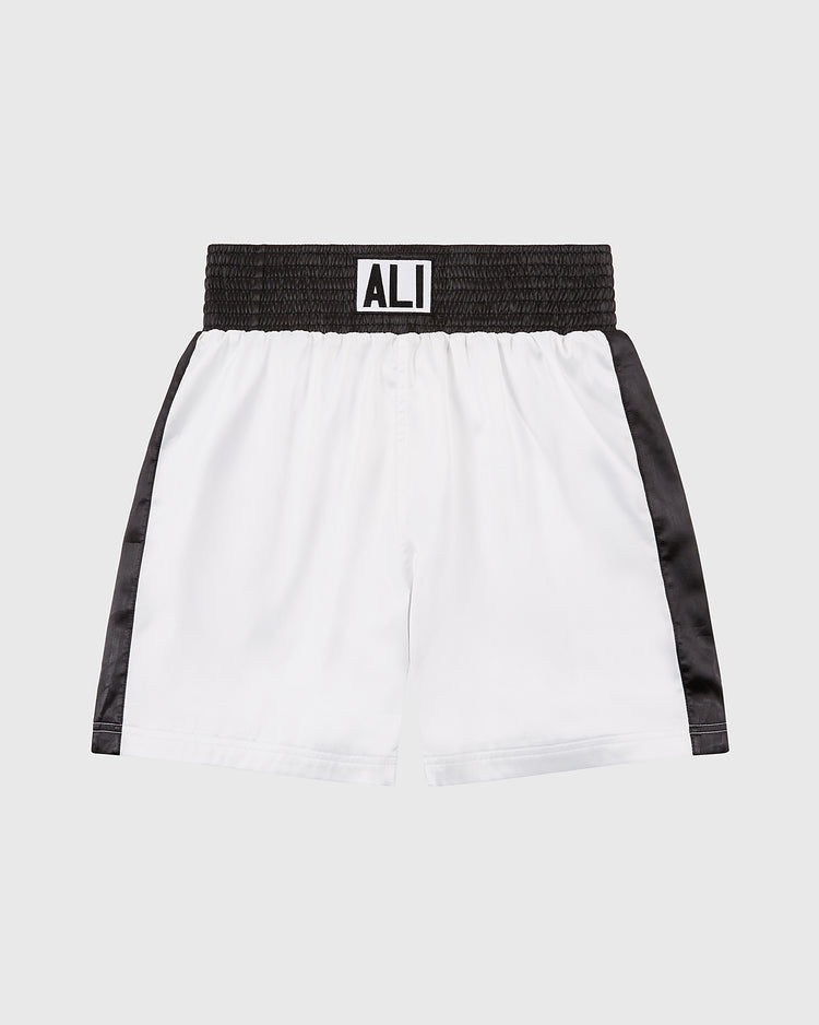 Ebbets Field's Muhammad Ali Vintage Inspired Boxing Trunks honor the 50th anniversary of the Thrilla in Manila with white fabric, black side panels, a wide black waistband, and bold “ALI” lettering—a timeless tribute to a boxing legend.
