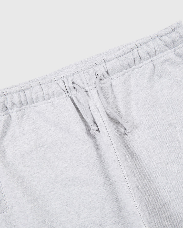 Close-up of the waistband on light grey Muhammad Ali Embroidered Heavyweight Cotton Terry Sweatpants by Ebbets Field, featuring an elastic band and drawstring. Shown on a white background; part of the iconic Thrilla in Manila collection.