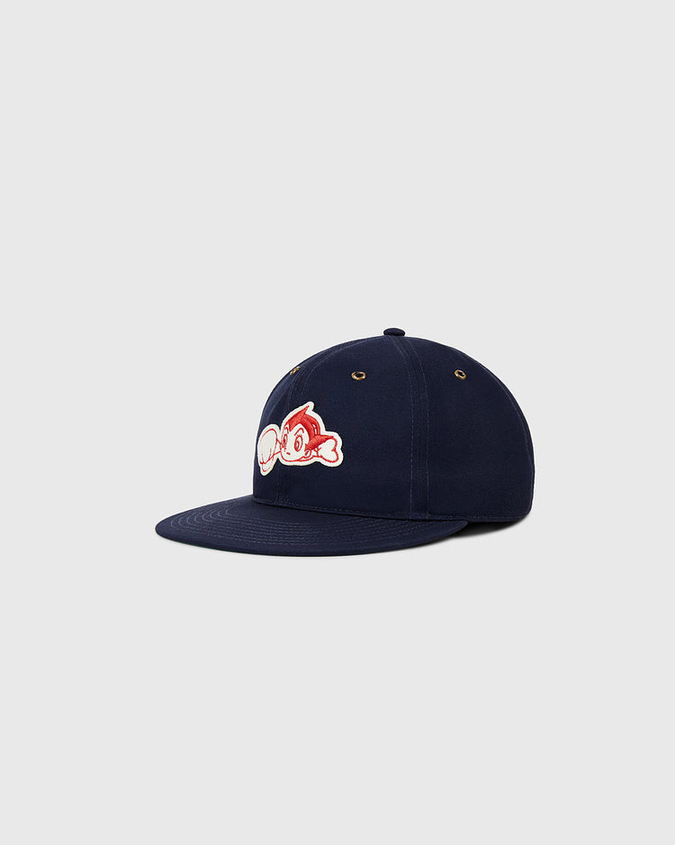 The Ebbets Field Sankei Atoms Cotton Twill Ballcap features a navy blue flat brim and an embroidered red and white fish graphic, inspired by Japanese baseball history, shown against a plain light grey background.