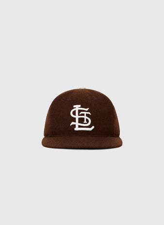 The Ebbets Field St. Louis Browns 1953 MLB Authentic Wool Ballcap features a brown flat brim, white interlocking STL logo, and is part of the Decade of Change Collection, shown against a light gray background.