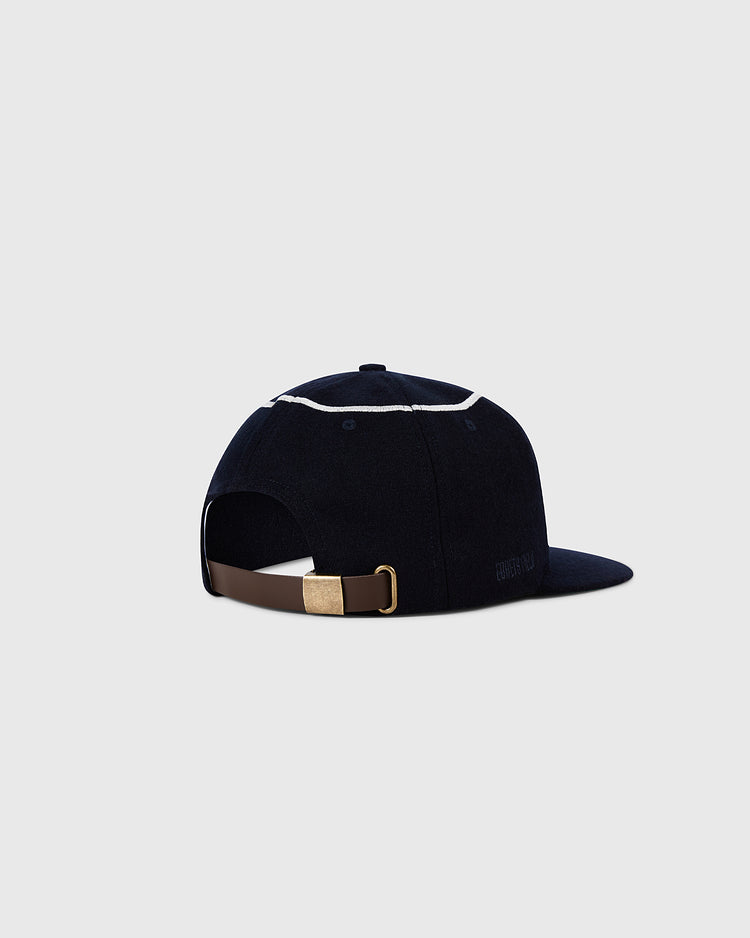 The Ebbets Field Los Angeles Angels 1961 MLB Authentic Wool Ballcap, in navy with white stitching, features a brown adjustable strap and brass buckle, inspired by classic on-field styles and shown on a light gray background.