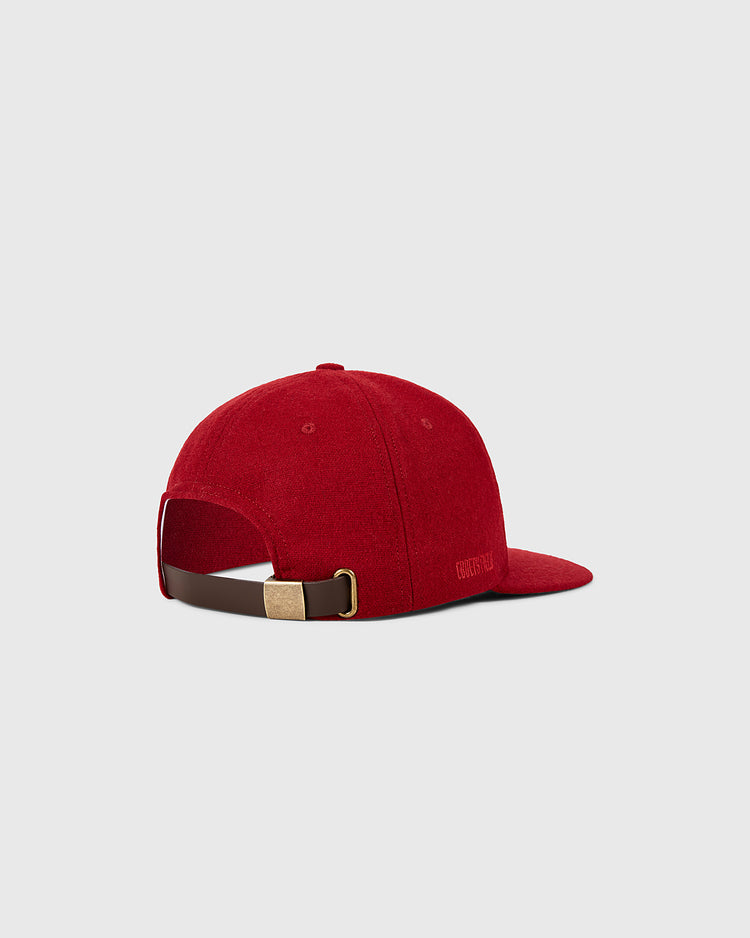 A rear view of the Ebbets Field Philadelphia Phillies 1964 MLB Authentic Wool Ballcap shows a red cap with a brown adjustable strap and gold buckle, set against a plain light gray background.