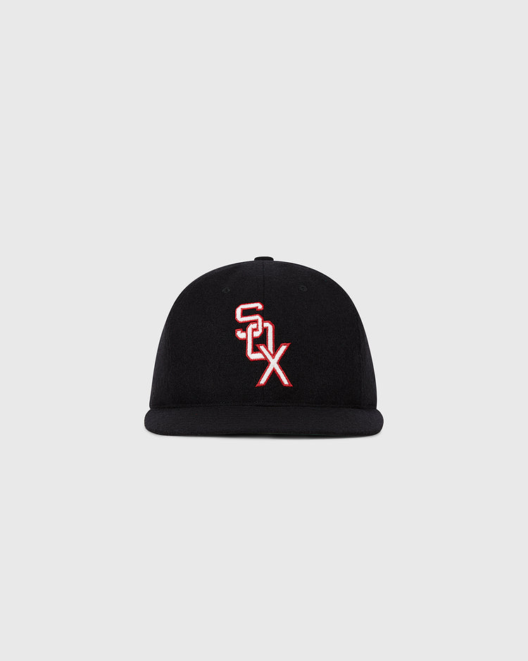 The Ebbets Field Chicago White Sox 1959 MLB Authentic Wool Ballcap is a black flat-brim hat with a white and red outlined SOX logo on the front, shown against a plain light gray background.