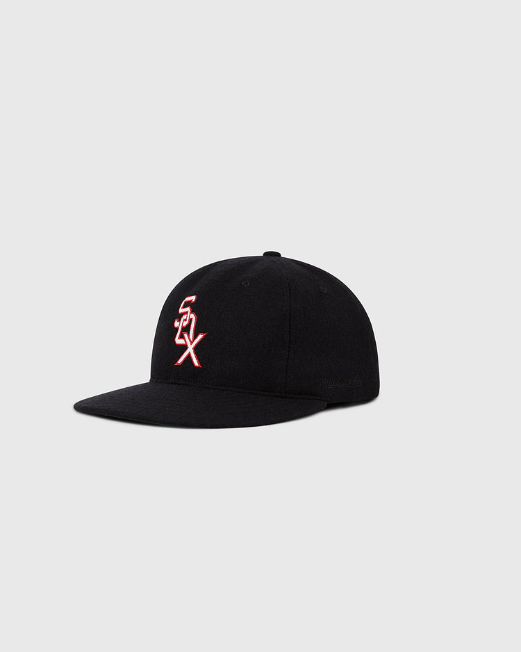 The Ebbets Field Chicago White Sox 1959 MLB Authentic Wool Ballcap features a black crown with a white and red SOX logo, inspired by the original 1959 design and shown on a plain light gray background. Part of the Decade of Change Collection.