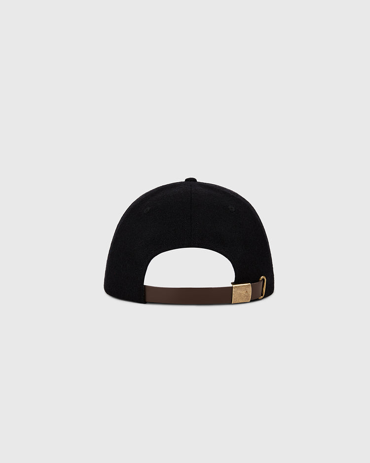The image shows the back of the Ebbets Field Pittsburgh Pirates 1960 MLB Authentic Wool Ballcap, a black cap featuring a brown adjustable strap with a brass buckle, displayed against a plain light gray background.