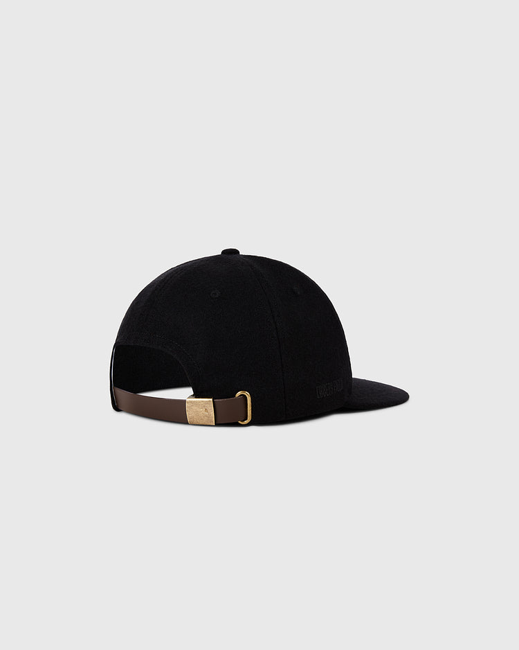 The Ebbets Field Pittsburgh Pirates 1960 MLB Authentic Wool Ballcap is shown from the back, highlighting its brown adjustable strap with brass buckle, set against a plain light gray background.