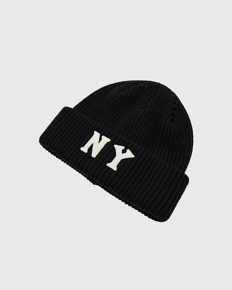 The Ebbets Field New York Black Yankees Felt Logo Ribbed Beanie features a black ribbed knit with a folded brim and bold white