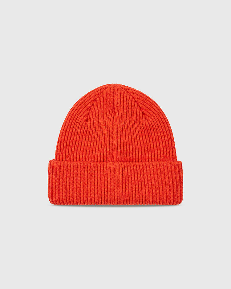 The Ebbets Field Sioux City Ghosts Embroidered Felt Ribbed Beanie, bright orange with a folded brim and inspired by the Ghosts, is shown against a plain light gray background.