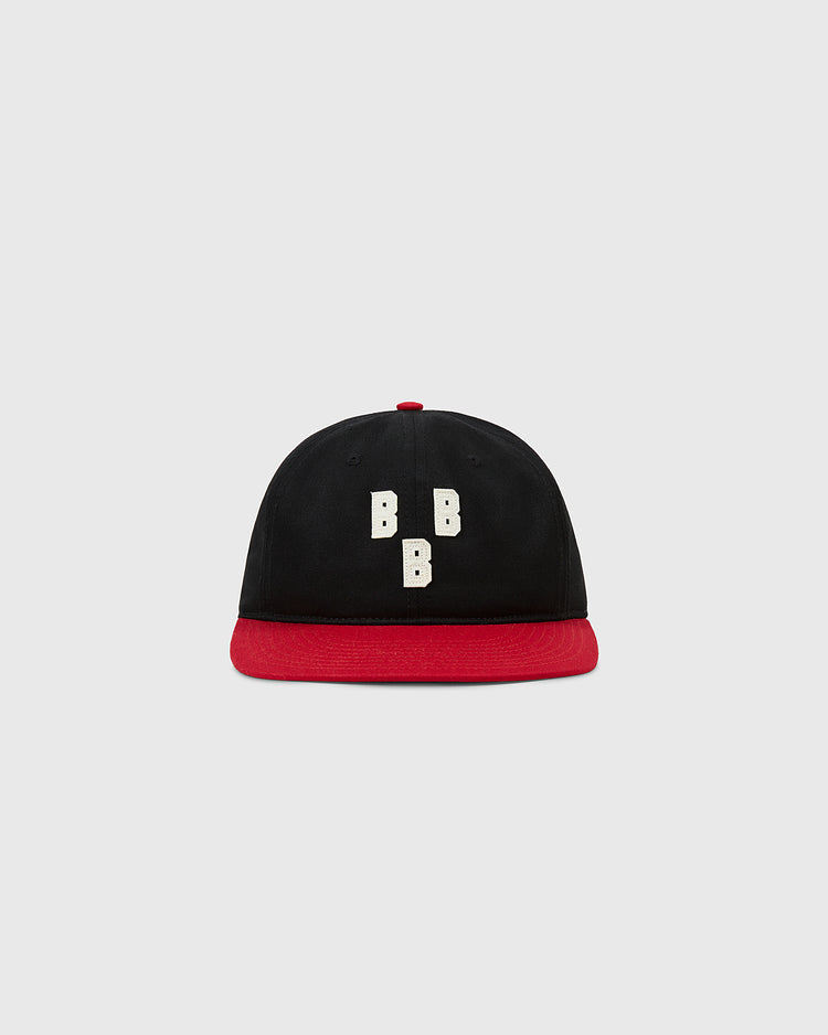 The Ebbets Field Birmingham Black Barons 1948 Cotton Twill Ballcap features a black crown, red brim, and three vertical white “B”s on the front, inspired by the historic Negro Leagues team, shown on a light gray background.