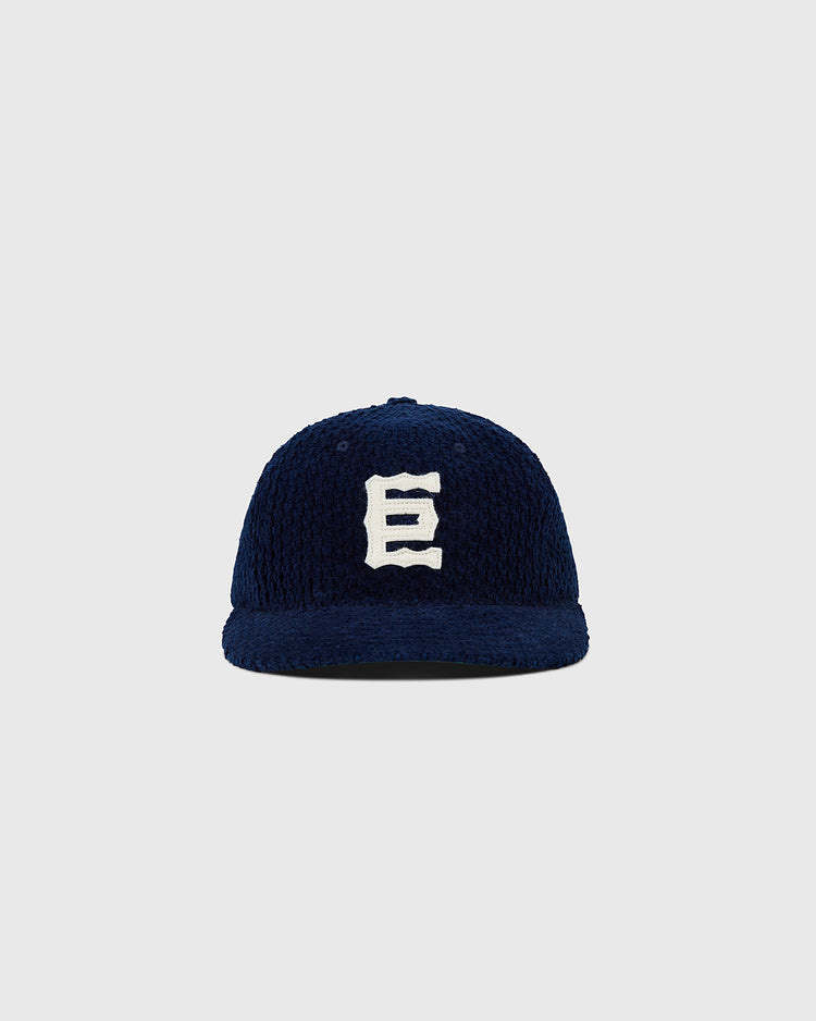 The Tokyo Giants Japanese Indigo Corduroy Ballcap by Ebbets Field features navy blue Japanese indigo-dyed corduroy and a bold white