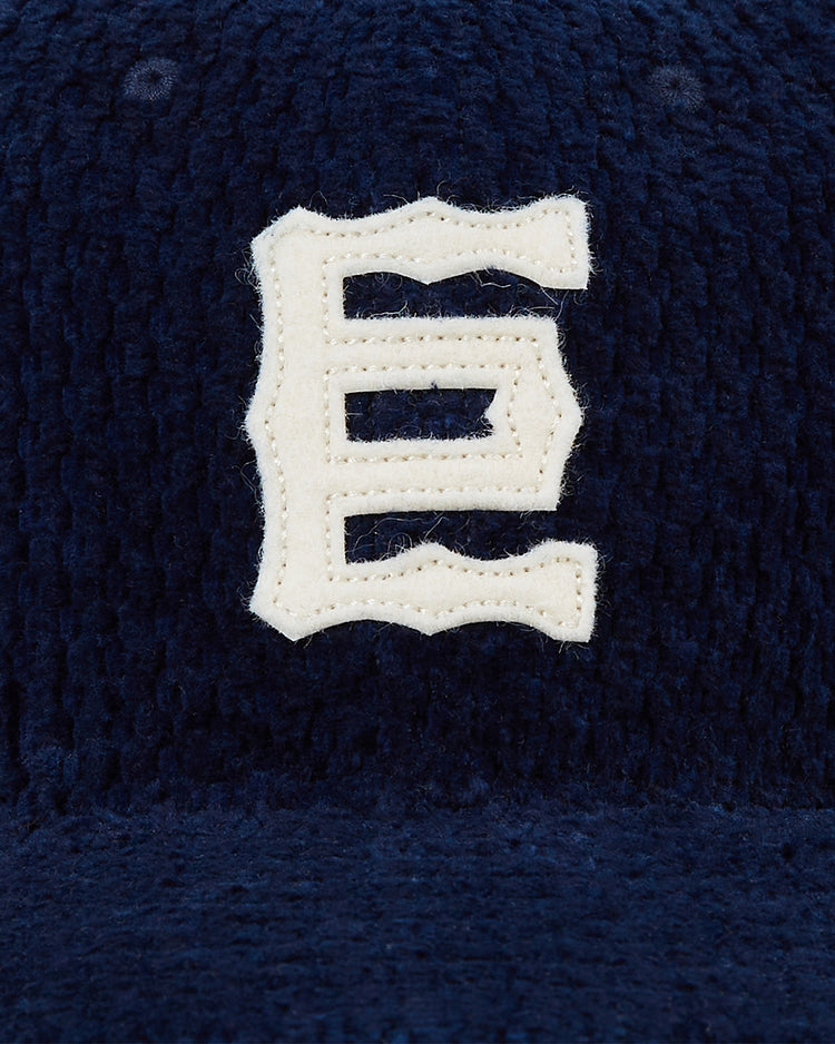 Ebbets Field’s Tokyo Giants Japanese Indigo Corduroy Ballcap features a dark blue indigo-dyed finish and a bold white embroidered