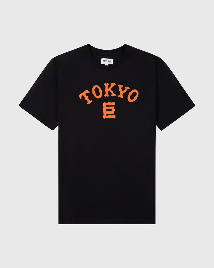 The Tokyo Giants Short Sleeve Graphic Tee by Ebbets Field is a black t-shirt with bold orange