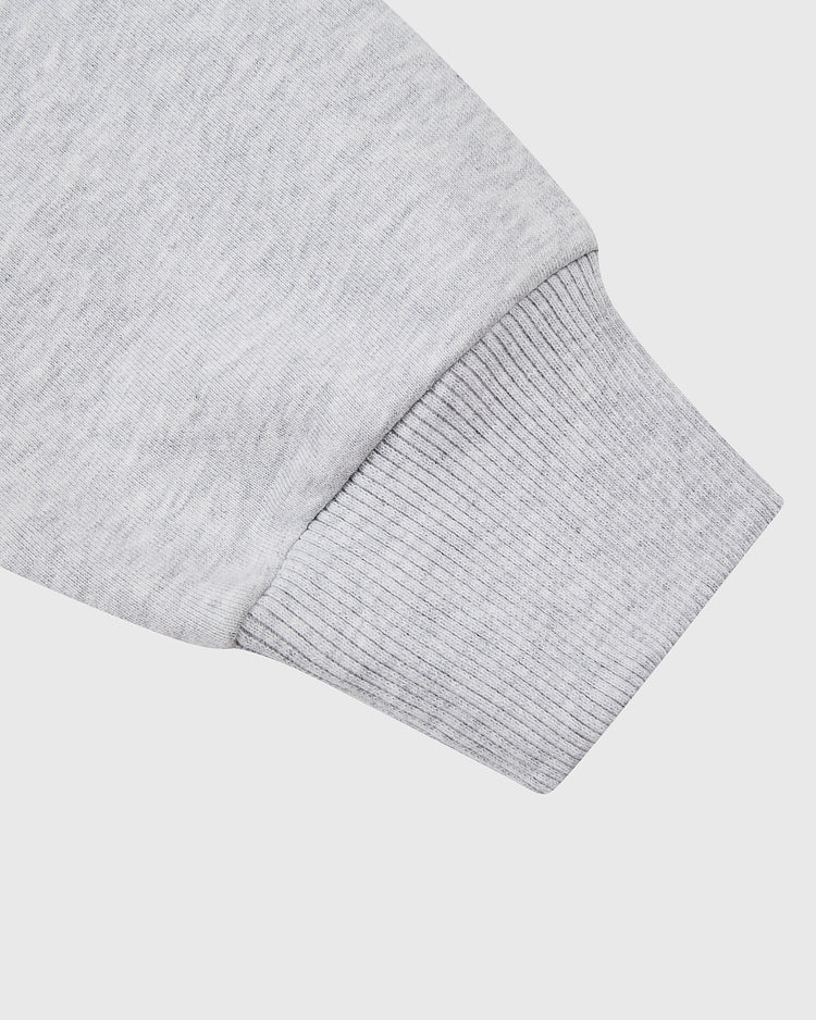Close-up of an Osaka Tigers Heavyweight Cotton Terry Full-Zip Hoodie sleeve by Ebbets Field, featuring a ribbed cuff, shown on a plain white background.