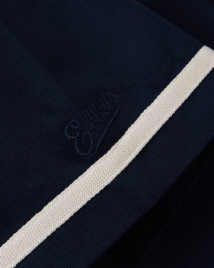 Close-up of dark navy cotton twill on the Ebbets Field Brooklyn Eagles Baseball Jersey, featuring
