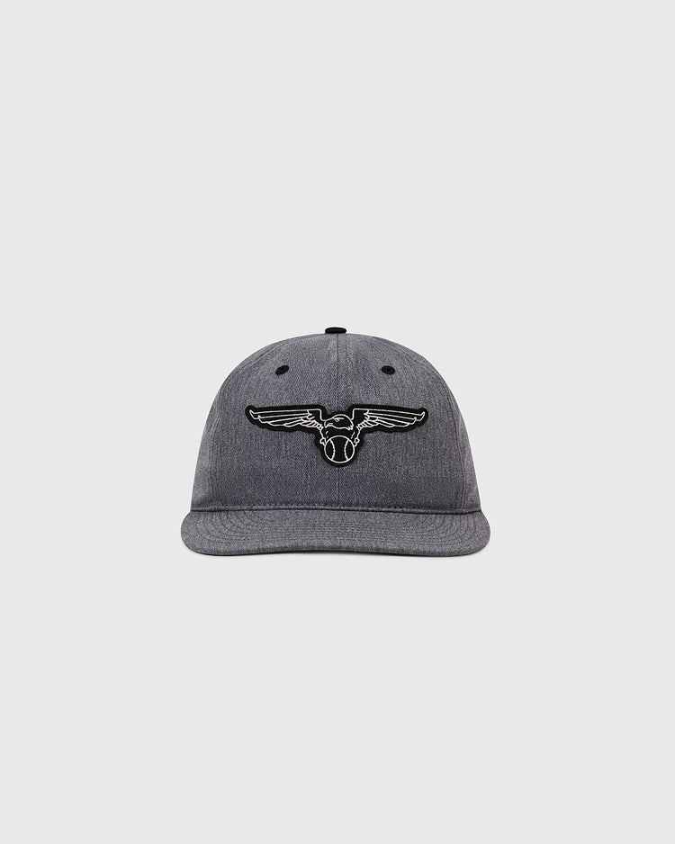 The Ebbets Field Newark Eagles Cotton Twill Ballcap features a grey design with a black and white winged bull's head inspired by the Negro Leagues, displayed on a plain light background.