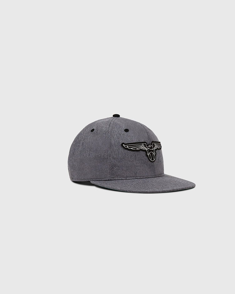 The Newark Eagles Cotton Twill Ballcap by Ebbets Field is a gray cap with a curved brim, flaunting an embroidered black-and-white winged logo inspired by the 1938 Newark Eagles, shown on a plain light gray background.