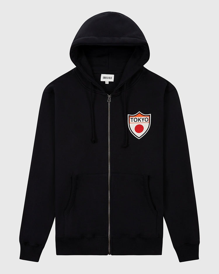 The Ebbets Field Tokyo Giants Heavyweight Cotton Terry Full-Zip Hoodie features front pockets, a drawstring hood, and a white left-chest patch with a red dot and bold TOKYO lettering for a retro vibe.