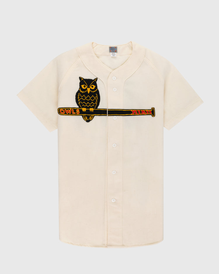 The EFF Topeka Owls 1947 Authentic Wool Home Baseball Jersey is cream-colored with a front button closure and features an embroidered owl on a bat with
