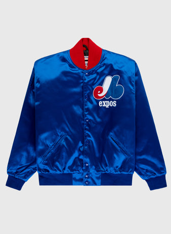 The EFF Montreal Expos 1969 Authentic All Satin Varsity Jacket features shiny blue satin, a red collar, team logo and expos on the left chest, front snap buttons, side pockets, and ribbed cuffs and hem.