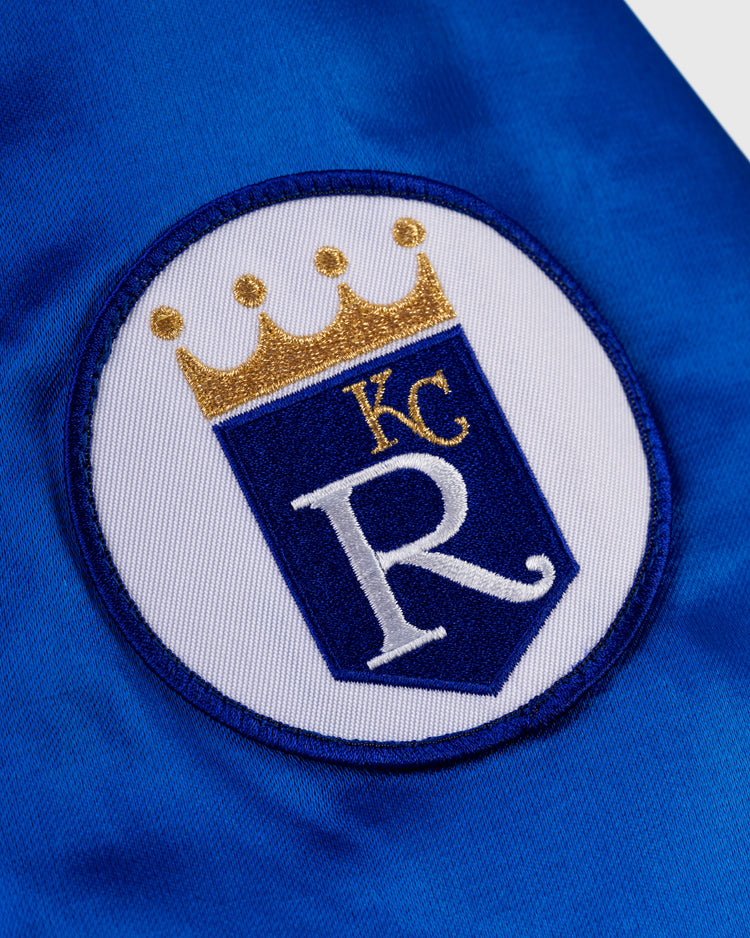 Embroidered patch with a gold crown, “KC,” and large “R” on a blue shield, set on white and blue—ideal for the EFF Kansas City Royals 1969 Authentic All Satin Varsity Jacket.