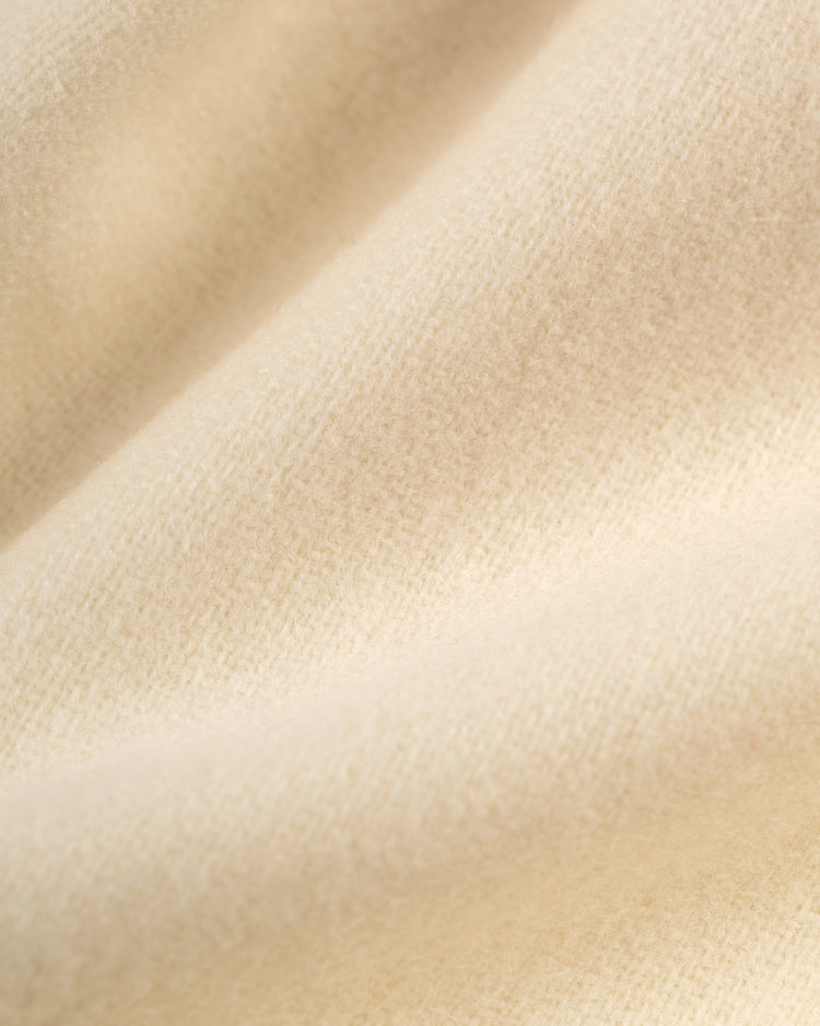 Close-up of soft, cream-colored wool with a fuzzy texture and gentle folds, as featured on the EFF San Francisco Sea Lions 1946 Authentic Wool Home Jersey, inspired by the classic Negro leagues team's vintage style.