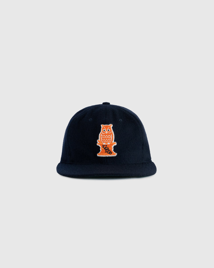 The EFF Owl Drug 1941 Authentic Wool Ballcap is a navy blue cap with an orange and white embroidered Owl logo, inspired by the historic Bay Area semi-pro team, shown against a plain light gray background.