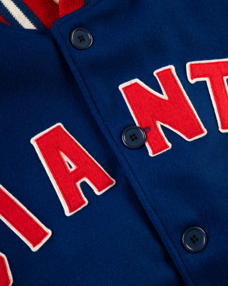 Close-up of the EFF New York Giants 1932 Authentic All Wool Varsity Jacket, featuring blue wool, red and white GIANTS lettering, navy buttons, and a striped collar—classic style inspired by the original 1932 design.