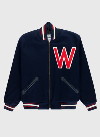 The EFF Washington Senators (Nationals) 1951 Authentic All Wool Varsity Jacket is navy with red and white striped cuffs, collar, hem, and a large red and white W patch on the left chest.