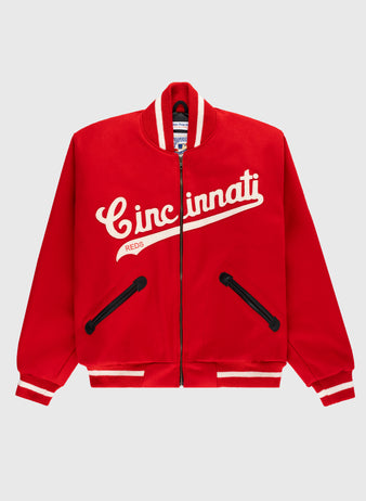 The EFF Cincinnati Reds 1969 Authentic All Wool Varsity Jacket features a red zip-up design, white stripes on the collar, cuffs, and hem, “Cincinnati Reds” in white script on the chest, and black-trimmed front pockets.