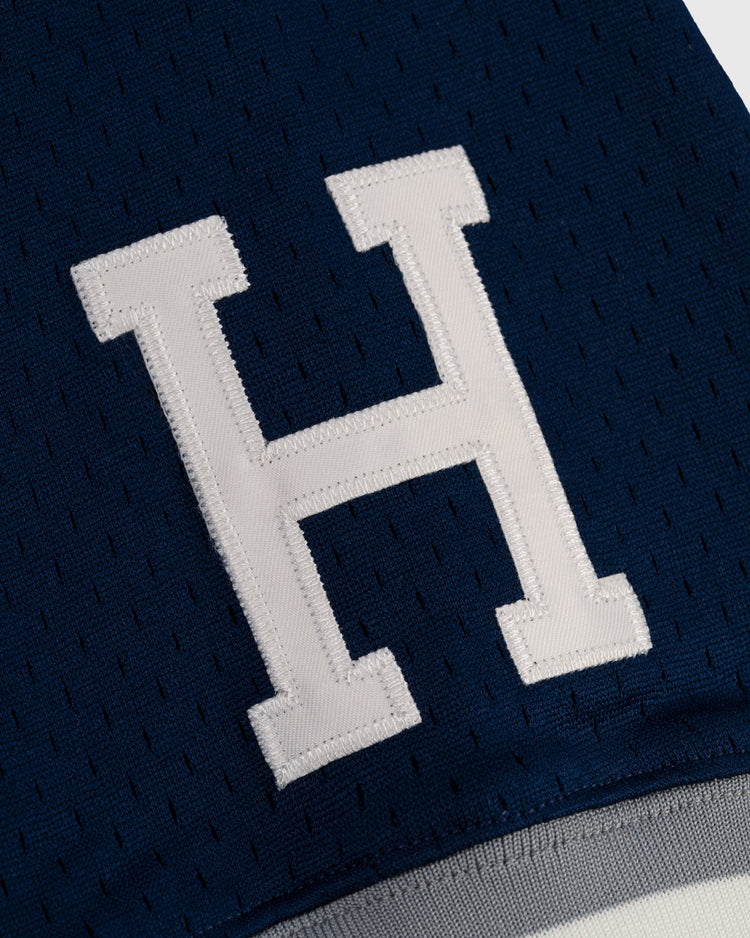 The EFF Homestead Grays Mesh V-Neck Jersey features a large white letter H stitched on dark blue perforated fabric, evoking classic baseball history and paying tribute to the iconic teamâs throwback style.