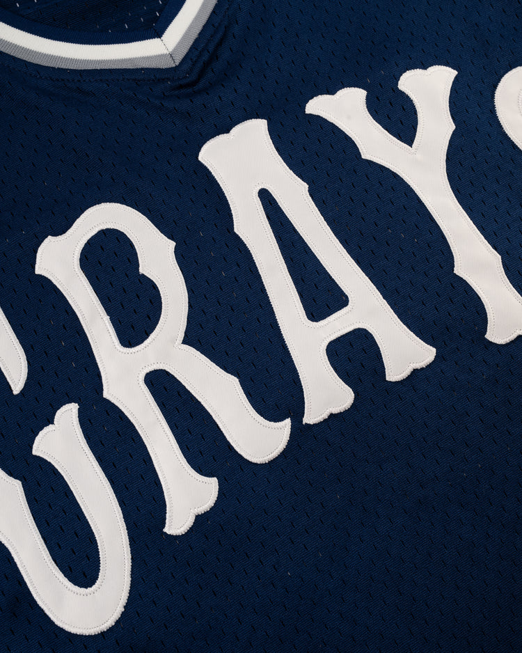 Close-up of the EFF Homestead Grays Mesh V-Neck Jersey, a blue throwback design featuring large white GRAYS lettering, honoring the legacy of the legendary baseball team.