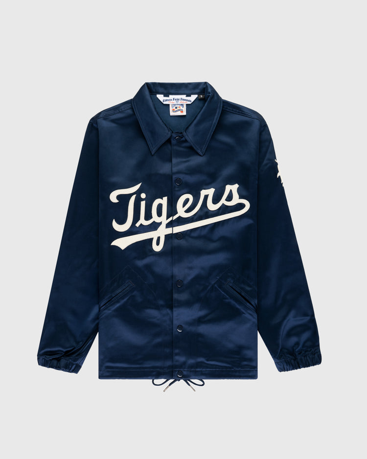 The EFF Detroit Tigers 1960 Satin Windbreaker Jacket is a navy blue jacket with Tigers in large white script, featuring a collar, elastic cuffs, front pockets, and a drawstring hem for classic MLB vintage style.