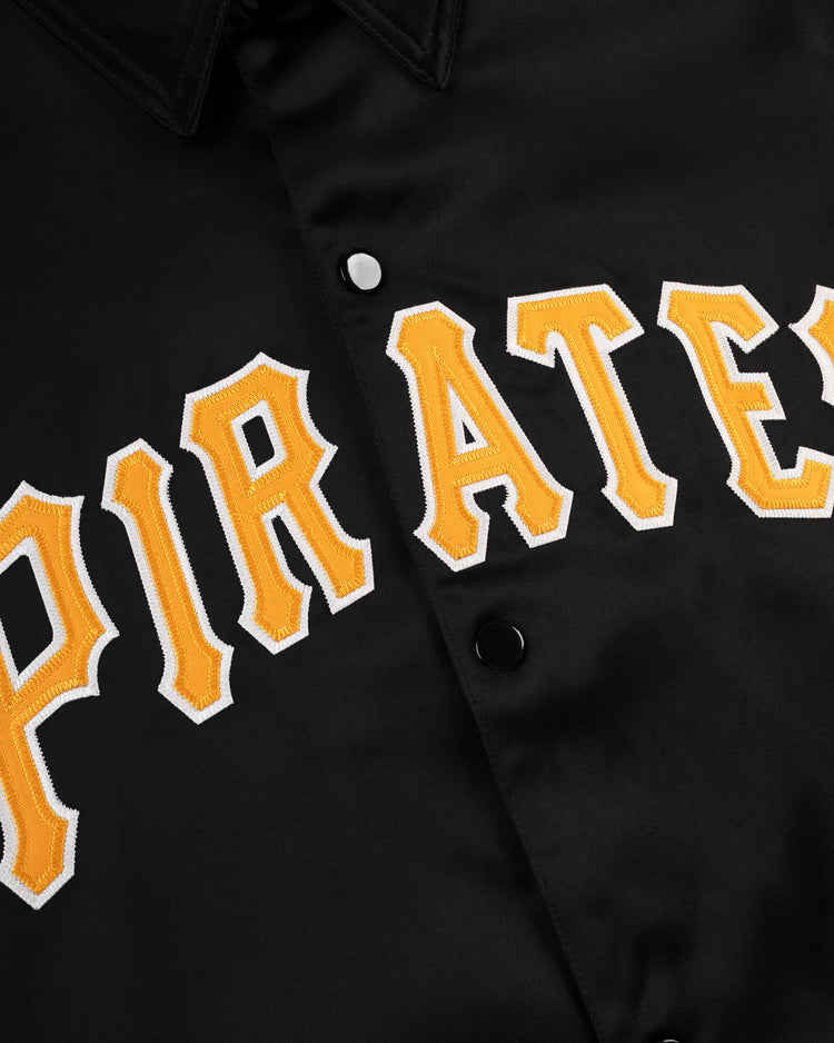 Close-up of the EFF Pittsburgh Pirates 1960 Satin Windbreaker Jacket, featuring bold yellow and white PIRATES embroidery across the front, evoking a vintage MLB look.