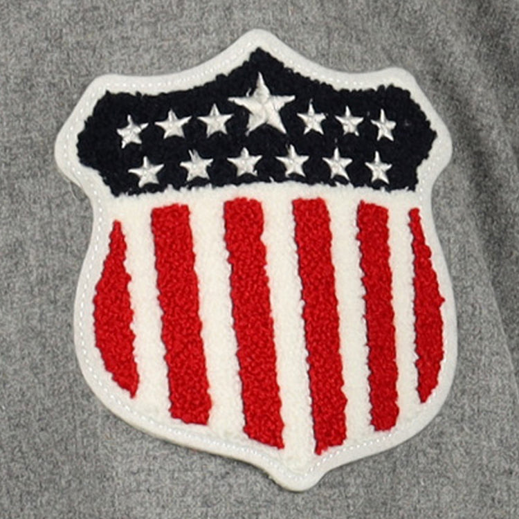 The EFF New York Black Yankees Vintage Inspired Replica Wool Jersey features a shield patch with red and white vertical stripes and a blue field with white stars, honoring baseball history and the Negro National League’s legacy.