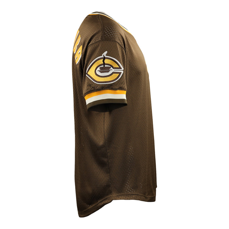 The EFF Cordoba Cafeteros DNA Replica V-Neck Mesh Jersey features brown fabric with yellow and white sleeve trim, a steaming coffee cup patch, and the number 94 on the shoulder, inspired by Mexican professional baseball. Photographed from a side angle.