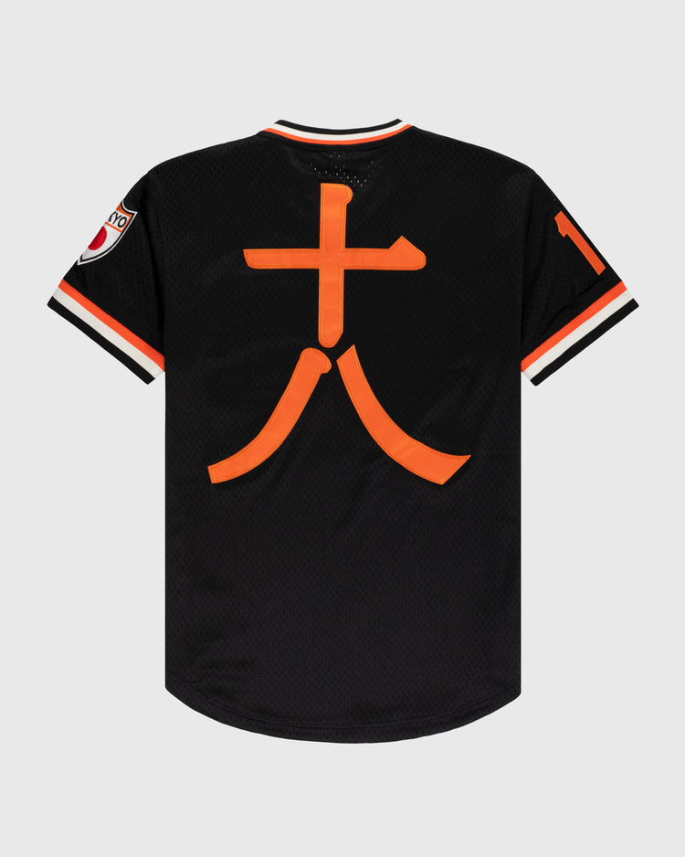 The EFF Tokyo Giants Mesh V-Neck Baseball Jersey is vintage-inspired in black with orange and white trim, a large orange 大 on the back, a patch on the left sleeve, and the number 10 on the right sleeve.