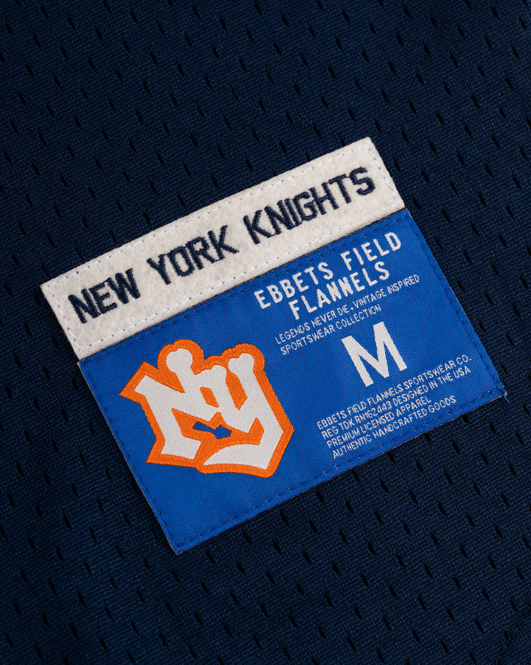 A close-up of the EFF New York Knights Mesh V-Neck Jersey tag shows NEW YORK KNIGHTS text, an orange NY logo, and EFF labels, indicating this medium jersey is made in the USA.
