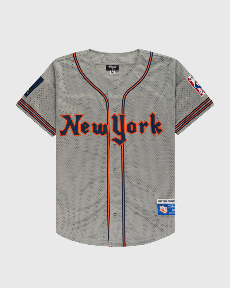 The EFF New York Knights Mesh Button-Up Baseball Jersey features New York in red and black, sleeve patches—including a Mets logo—and black/red sleeve stripes, inspired by The Naturals iconic uniform.