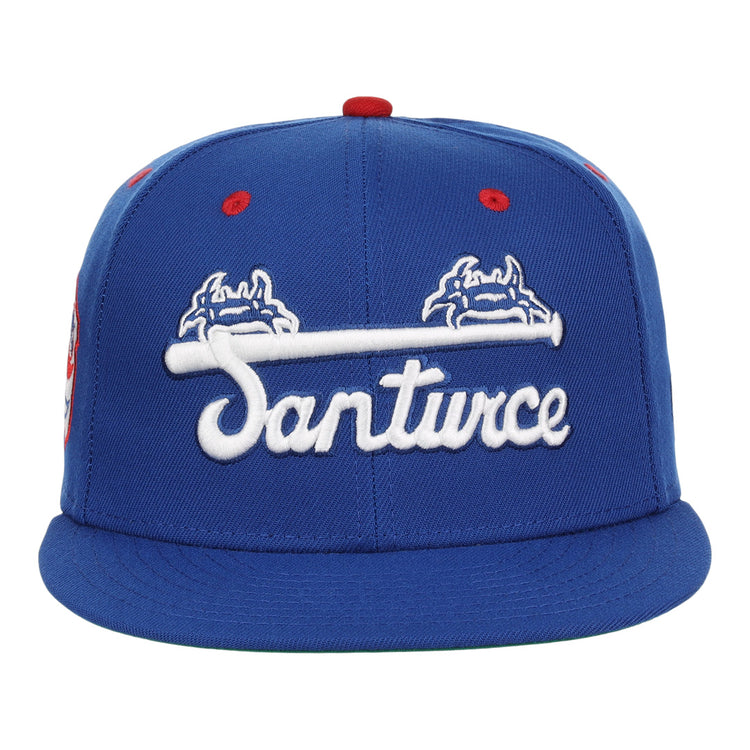 The EFF Santurce Cangrejeros NLB Team Color Fitted Ballcap is a vintage-inspired blue cap with “Santurce” in white script and crab graphics, celebrating the Puerto Rican League legacy.
