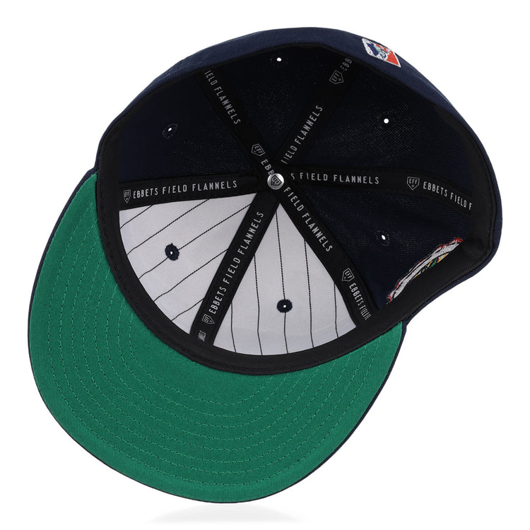 An inside view of the Atlanta Black Crackers NLB Team Color Fitted Ballcap by EFF, featuring a green underbill, black EFF-marked sweatband, grey pinstriped lining, and visible top button with vent holes.