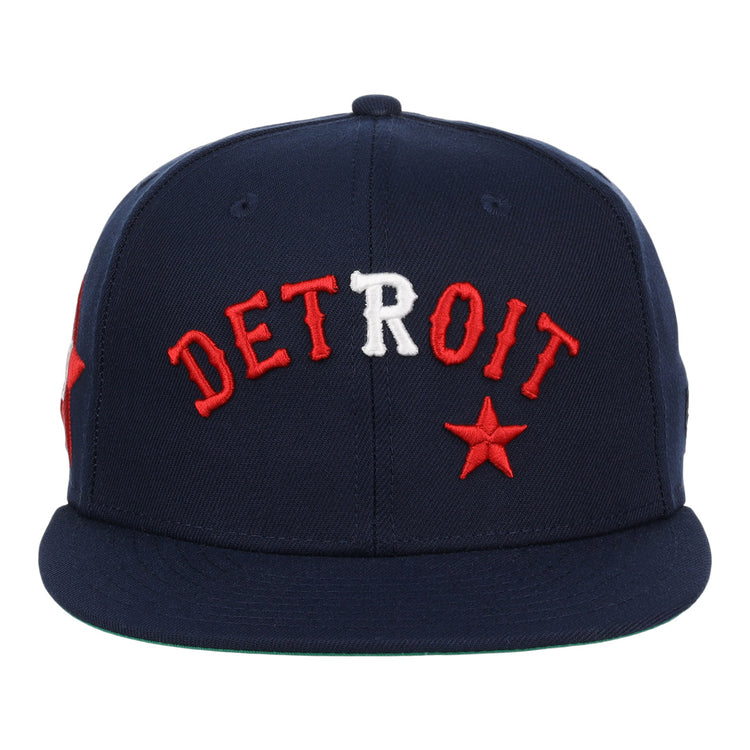 The EFF Detroit Stars NLB Team Color Fitted Ballcap is a vintage-inspired navy cap with bold red and white DETROIT embroidery and a red star, celebrating the legacy of the Negro National League.